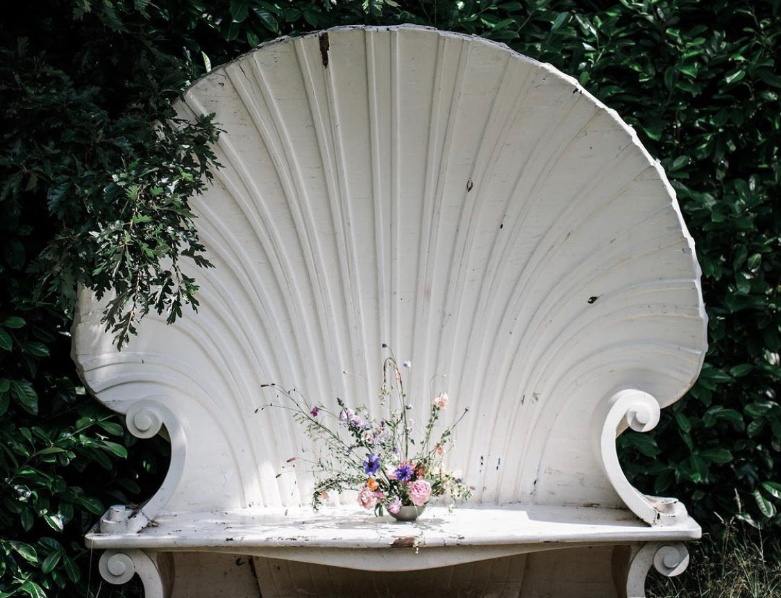 Shell shaped bench in garden 